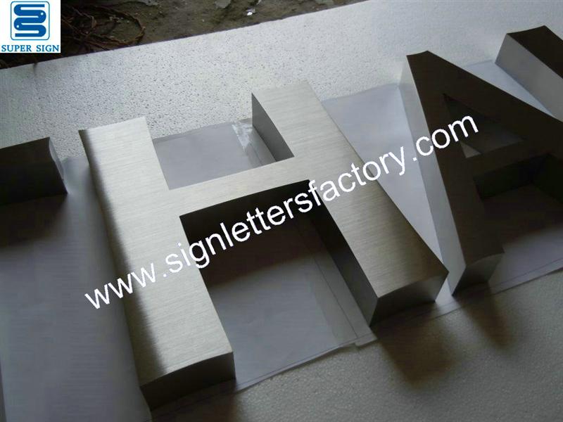 built-up brushed stainless steel letters