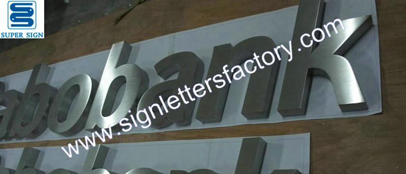 fabricated brushed stainless steel letter business sign